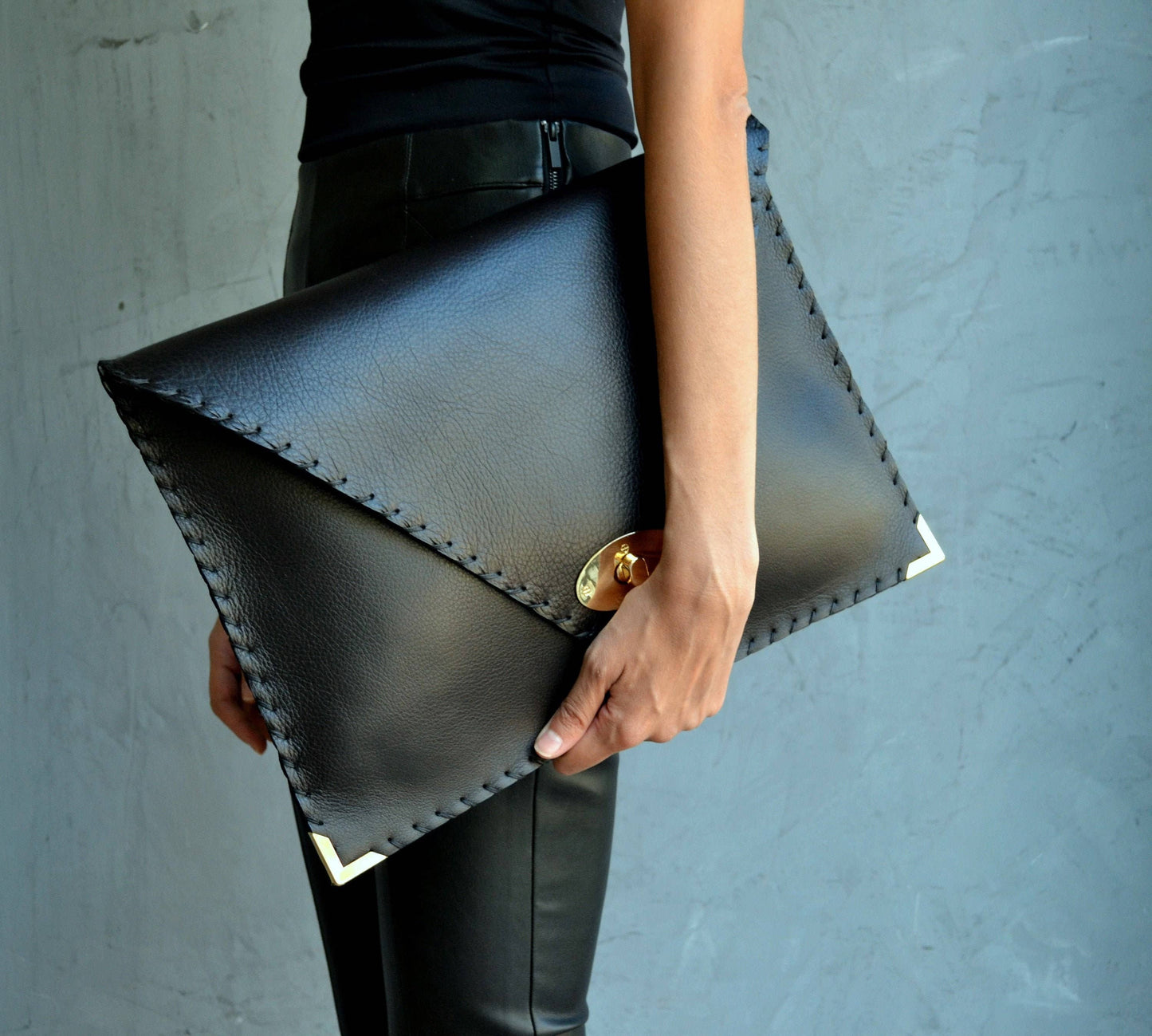 ANA KOUTSI - Symmetria black leather clutch bag: Silver / Small