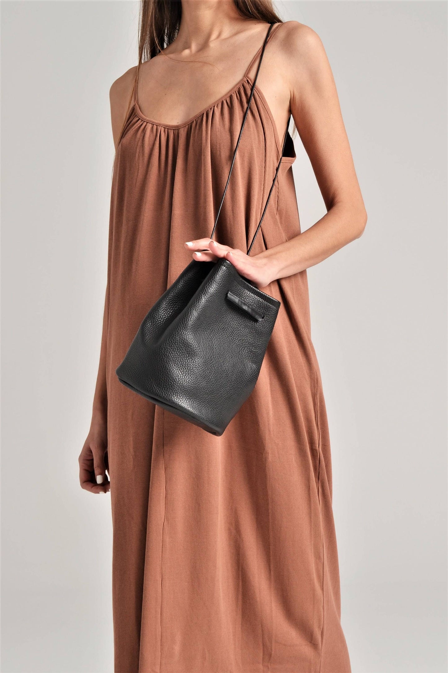 ANA KOUTSI - Ioli leather bucket bag in black
