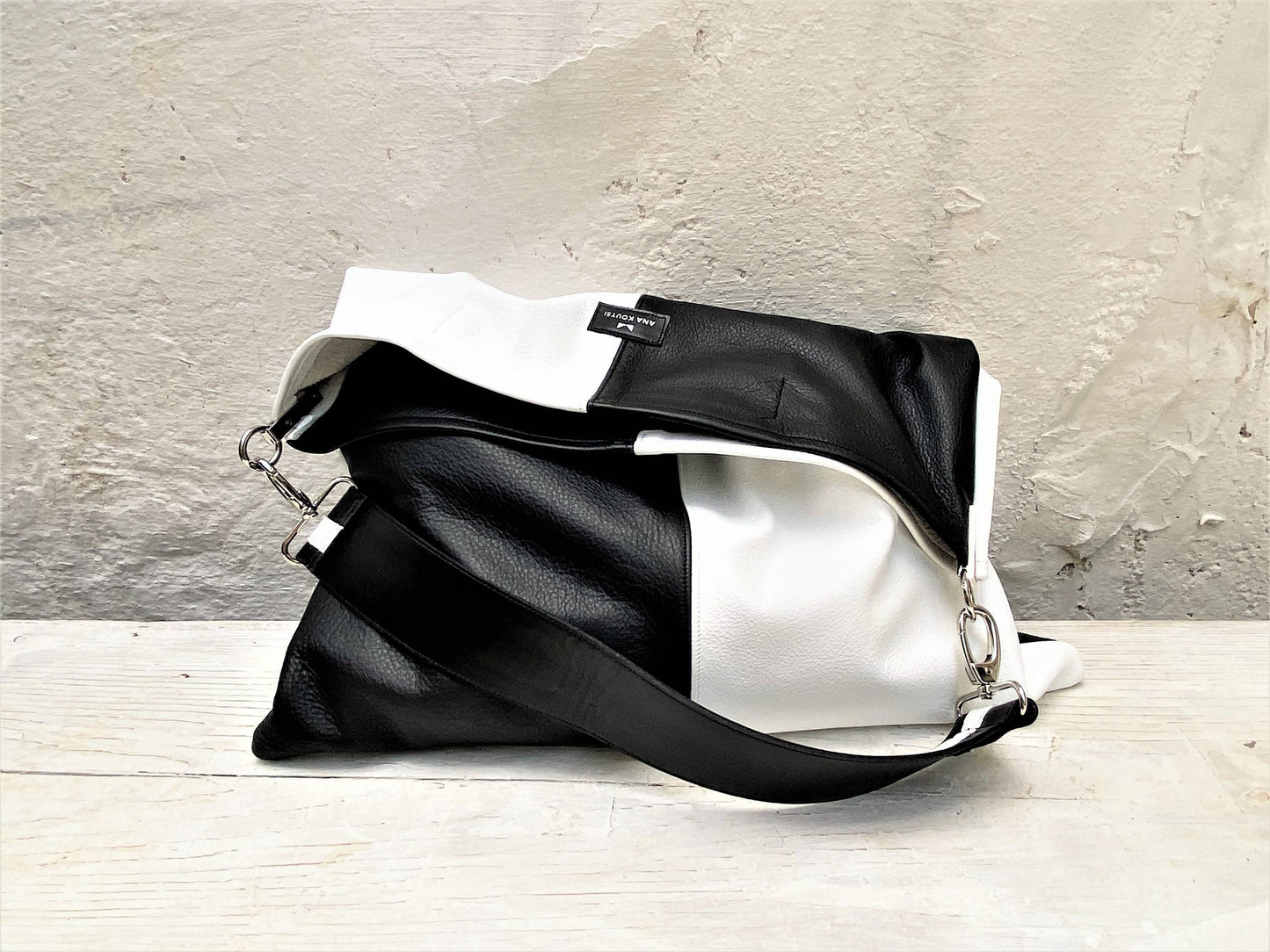 ANA KOUTSI - Akathi double leather bag in black & white